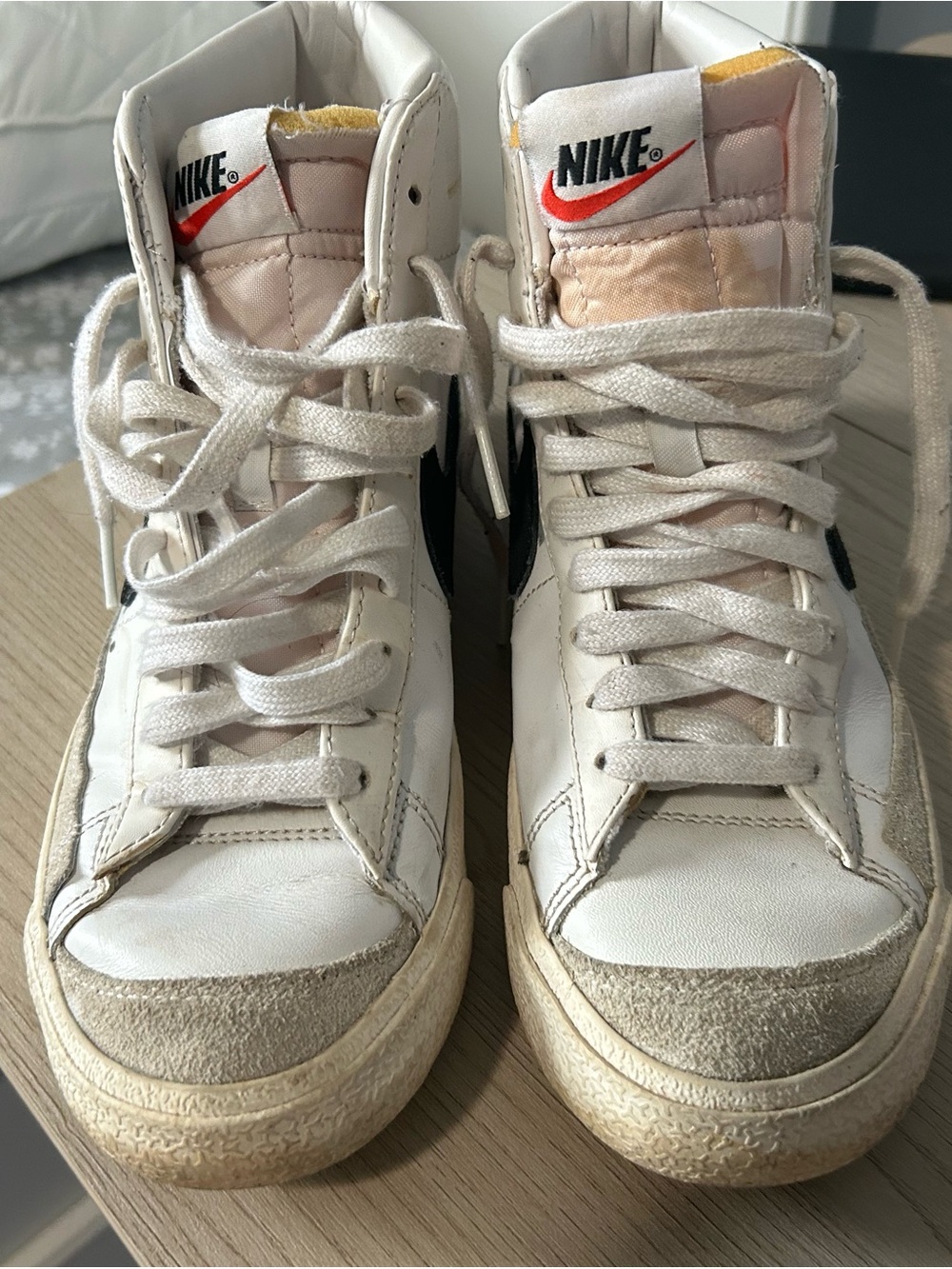 Nike Women's White High-Top Sneakers with Red Logo
